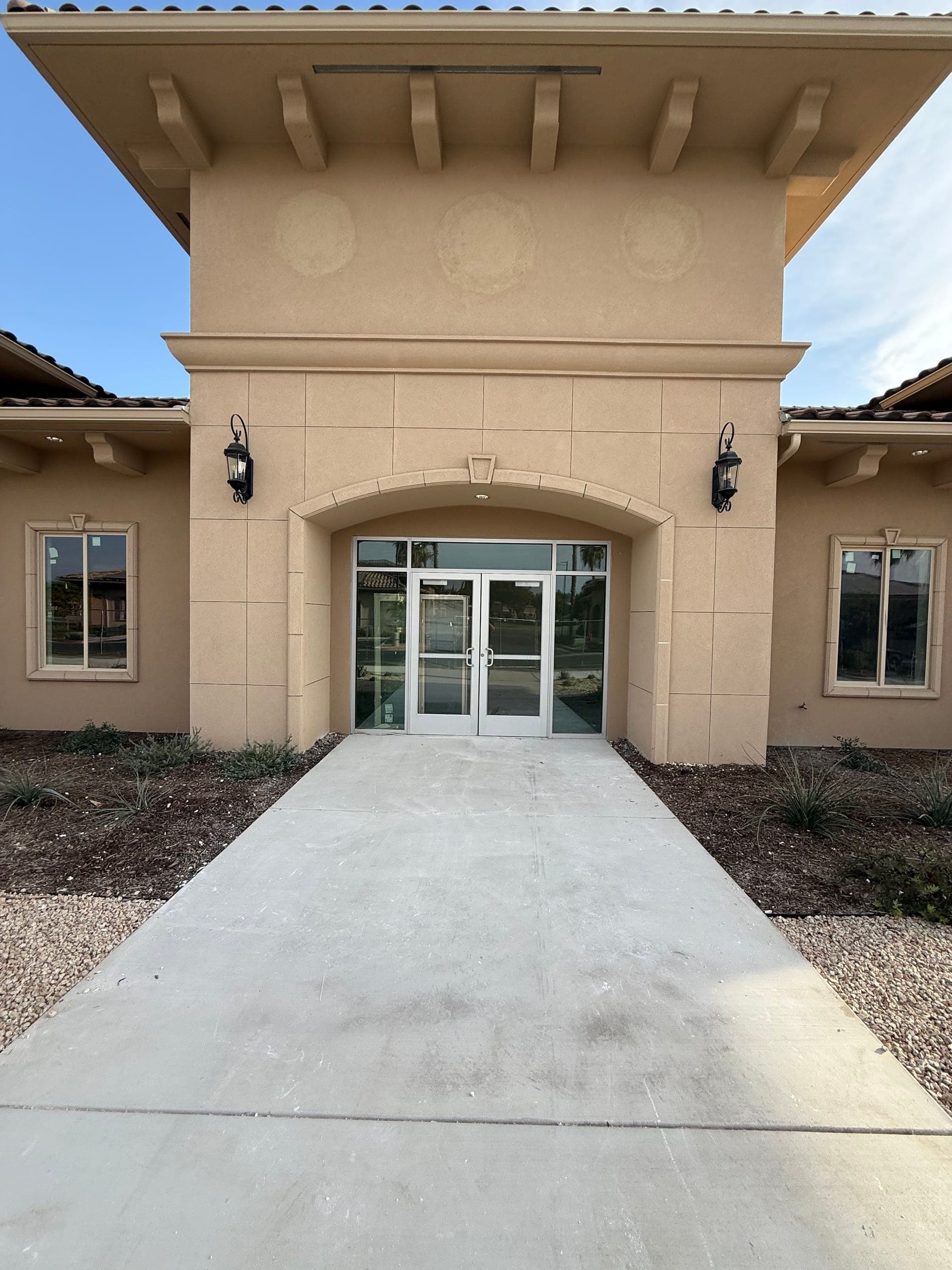The same Clovis commercial entrance after Papi's hauled the drywall, walkway swept clean