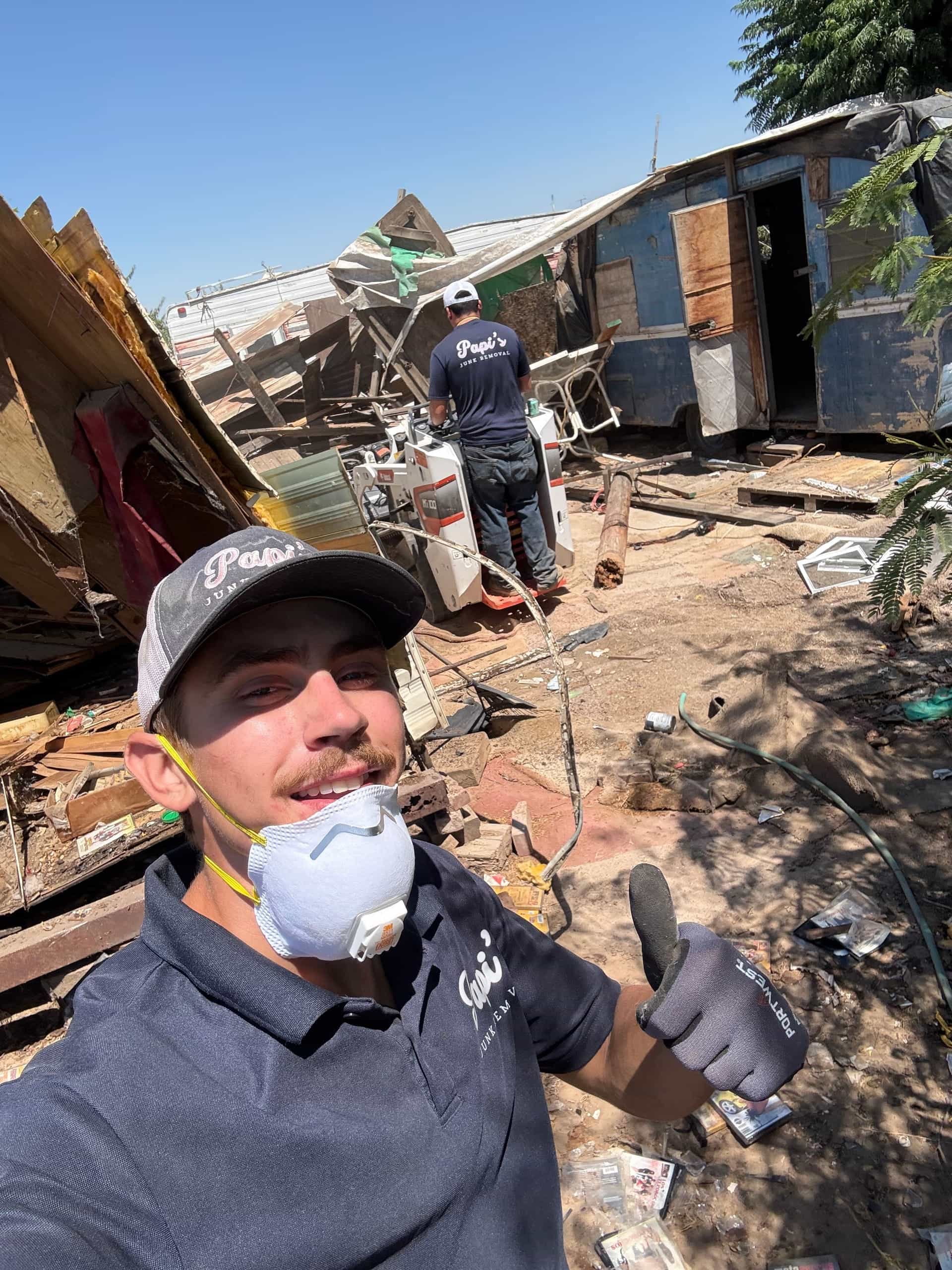 Papi's crew member at a backyard teardown near Sanger