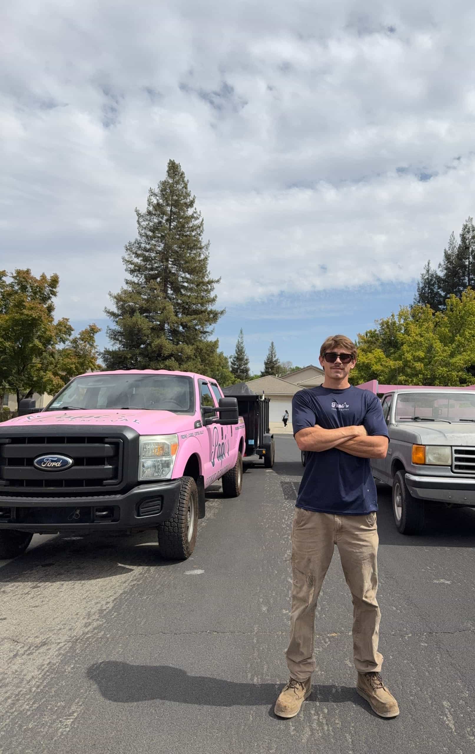 Papi's crew member in front of the pink Papi's F-250 in Clovis, home base