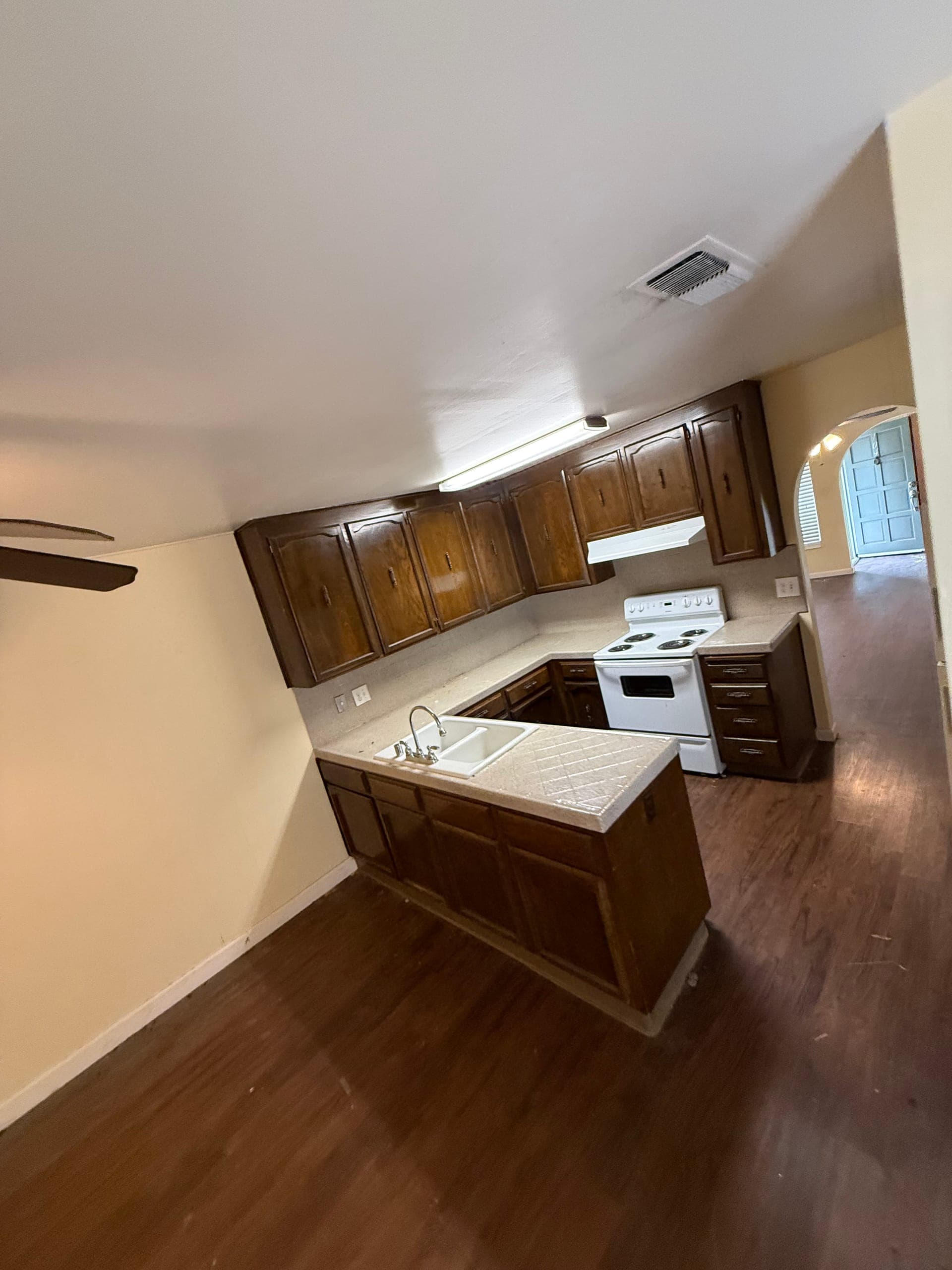 Empty kitchen and living area after a full estate cleanout by Papi's Junk Removal