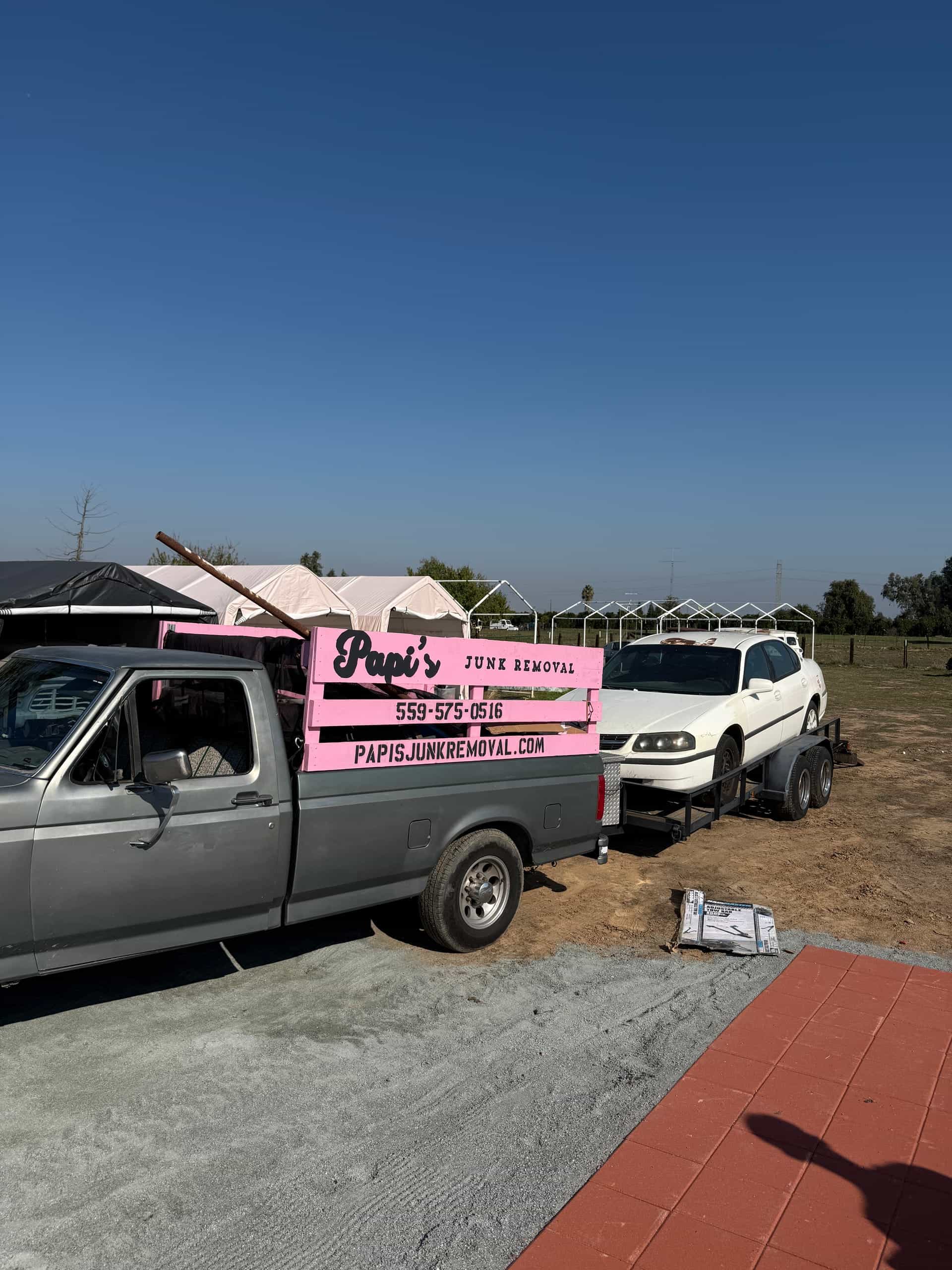 Papi's pink-rack truck at a Central Valley cleanup, the same rig that runs to Selma